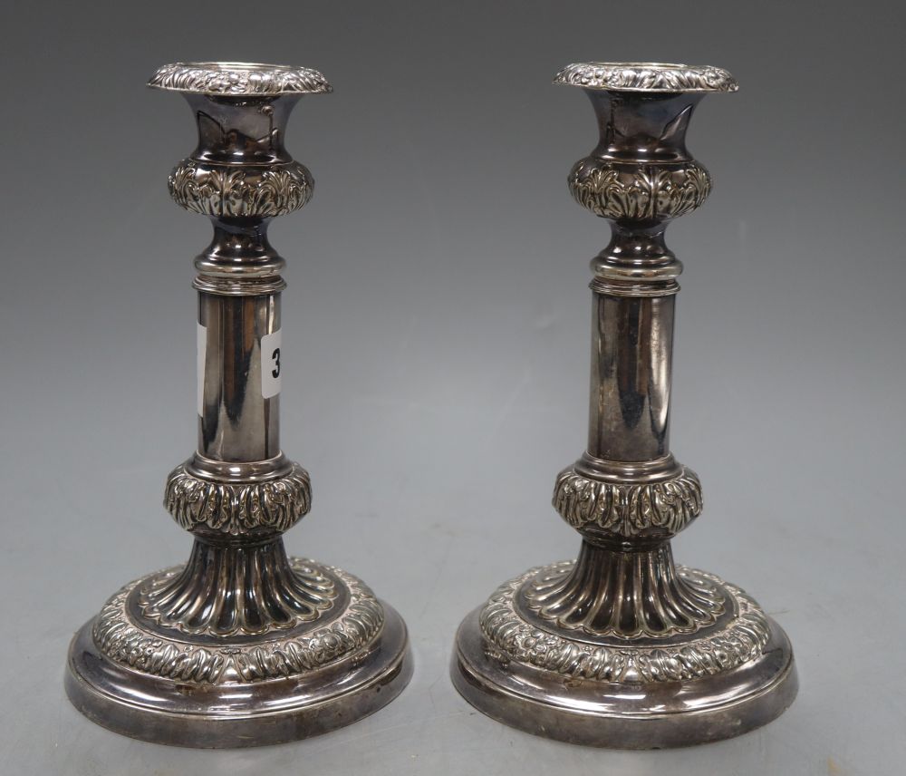 A pair of old Sheffield plate candlesticks